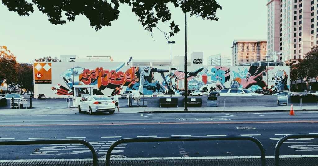 The side of an industrial building in San Jose decorated with graffiti