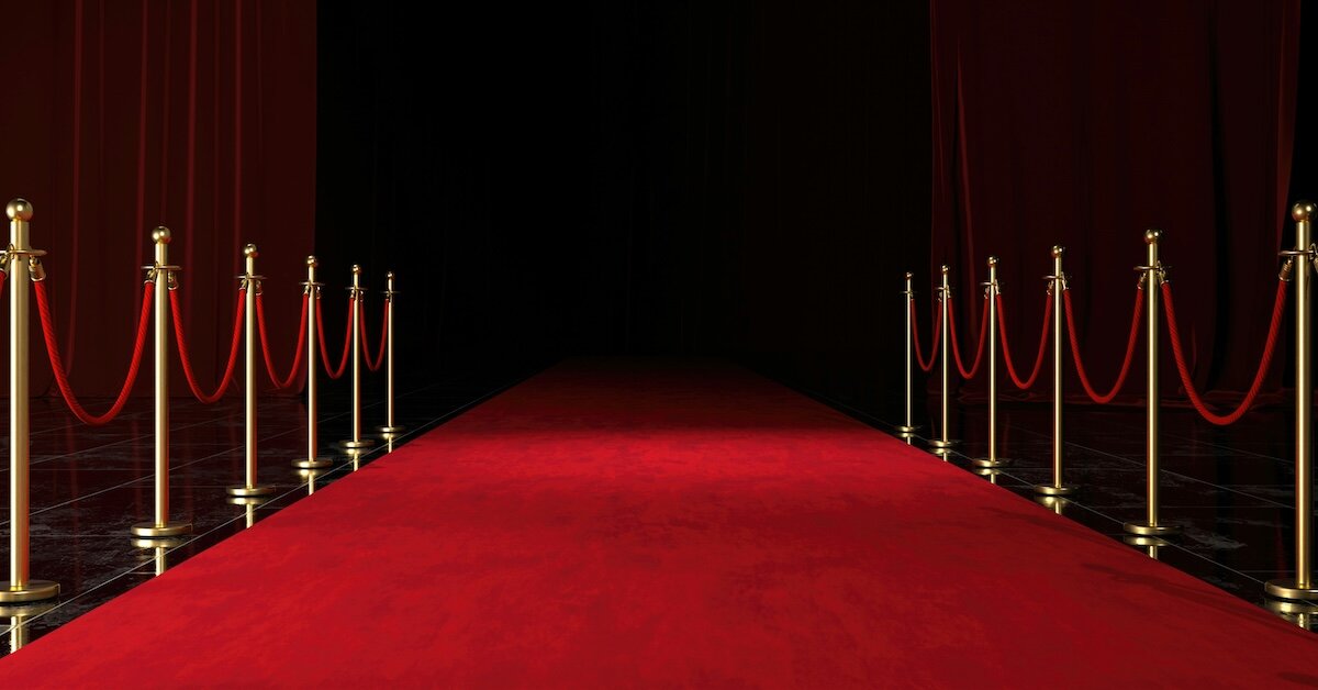 A empty red carpet waiting for people to walk down