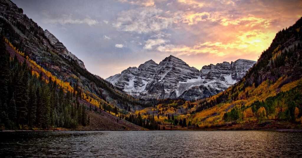 Mountains with a sunset shining behind them in Colorado