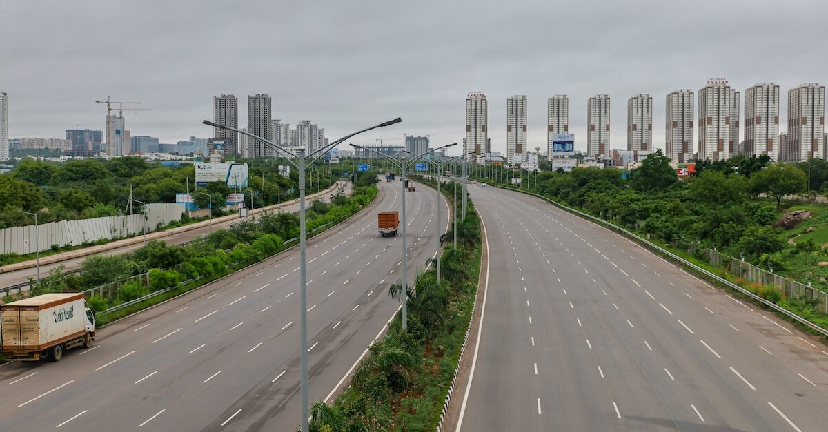 a highway with the city skyline in the background