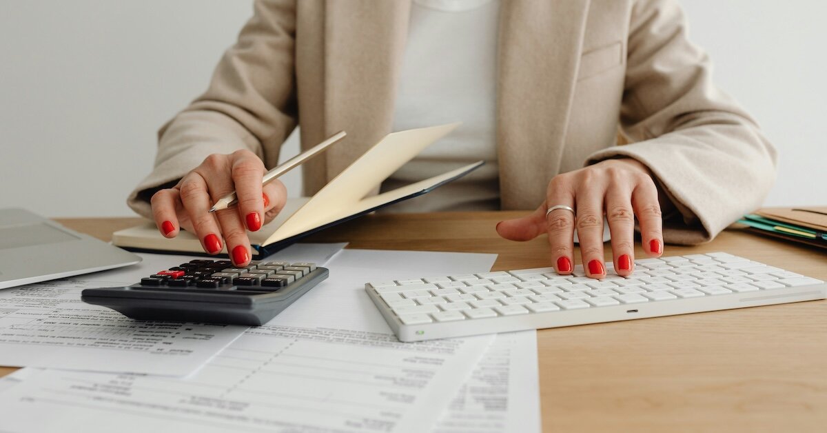 A woman calculates her savings on her real estate property tases using cost segregation