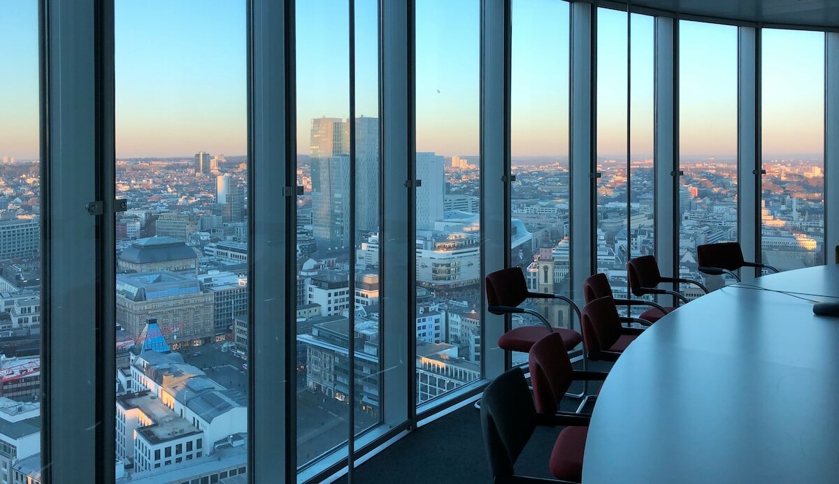 a view of a city from an office conference room in a sky tower 