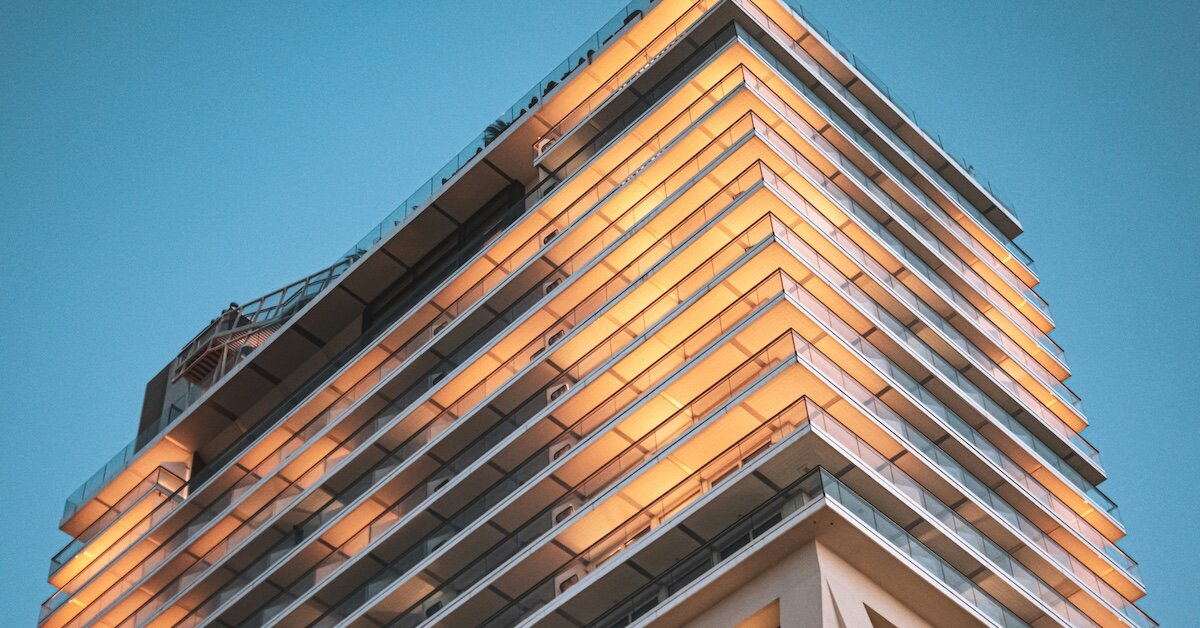 a lit up hotel against a dusky blue sky