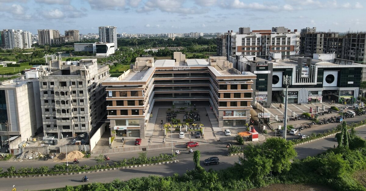 commercial buildings with one with a large courtyard in the foreground