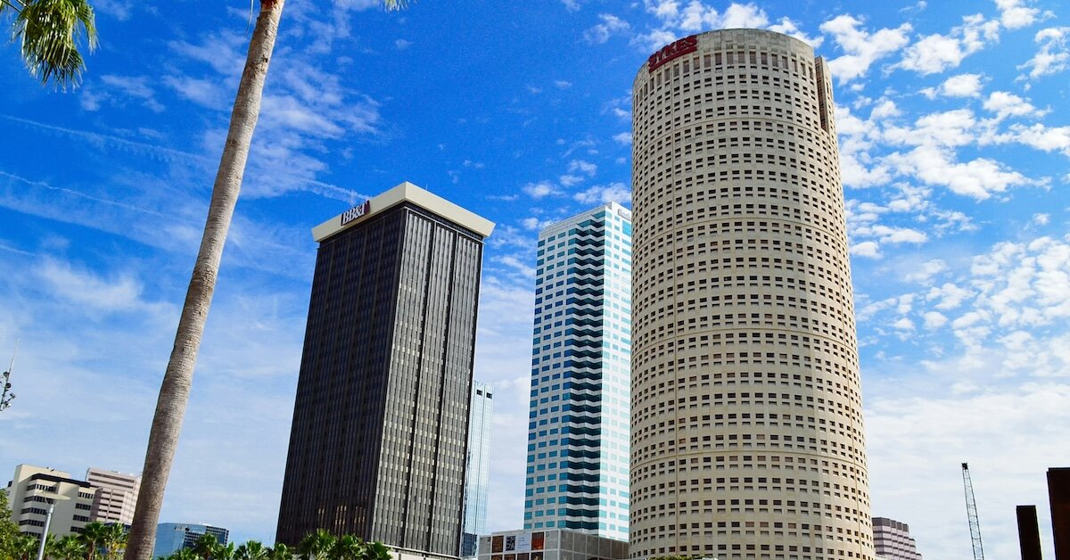 Tall buildings stand against the blue Tampa sky