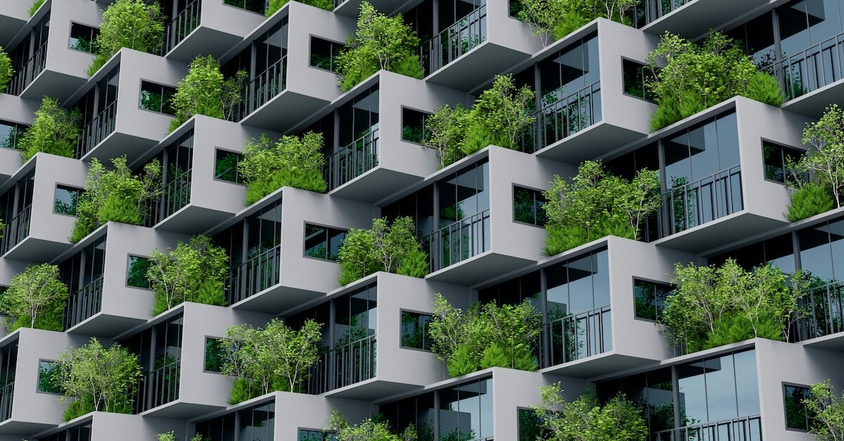 A stack of building floors with trees on the balconies