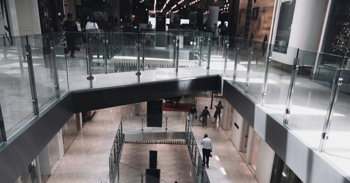 Interior of a commercial building with people walking around on different floors