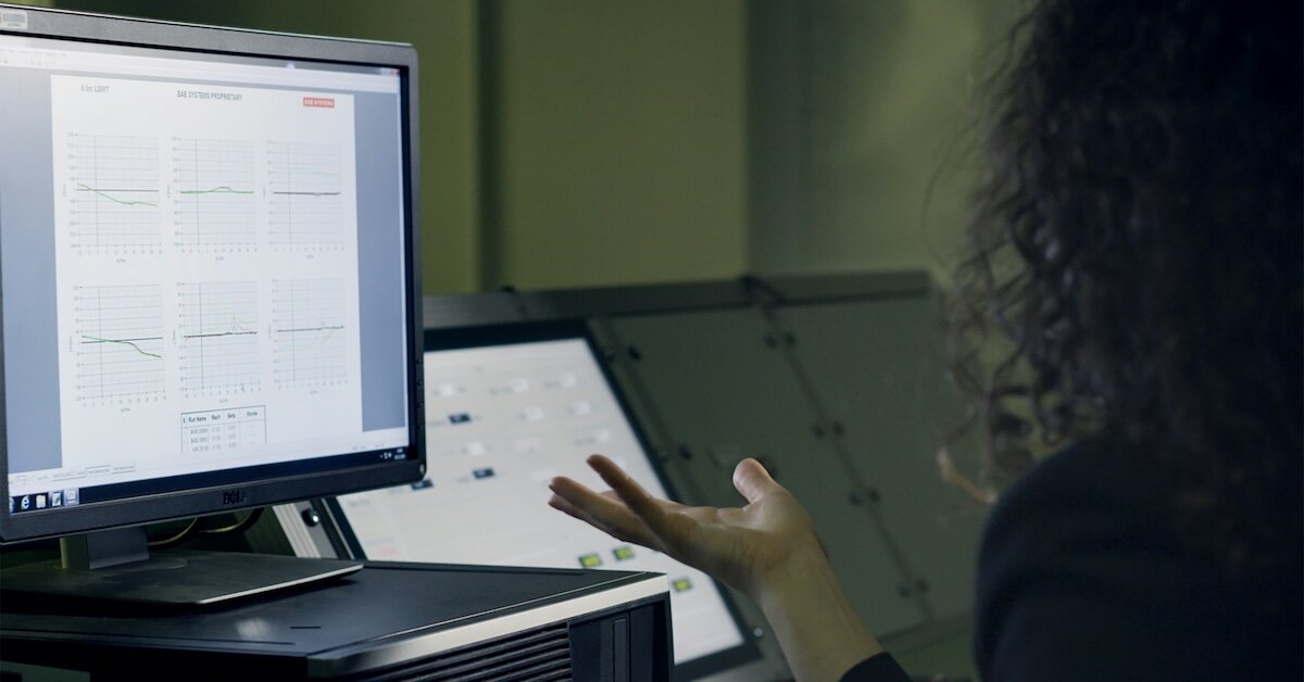 a person looking at their computer calculating comps data