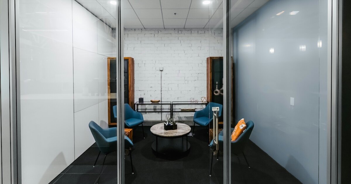 An outside shot looking into a fishbowl conference room.