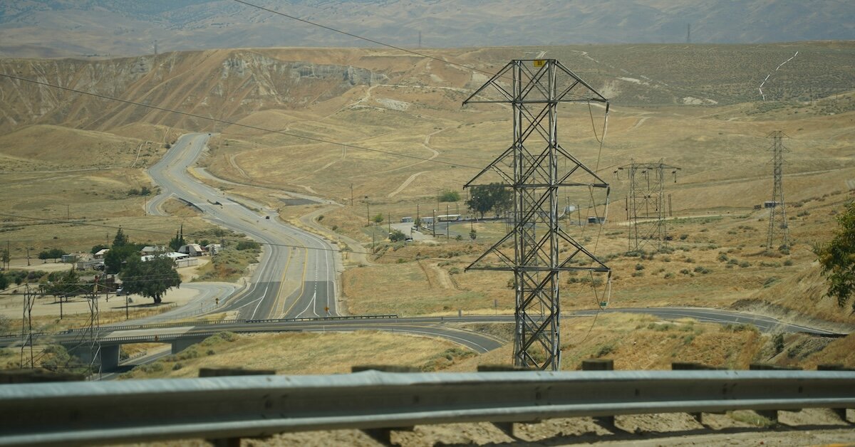 Telecom wires and towers dot a large path in CA's central valley