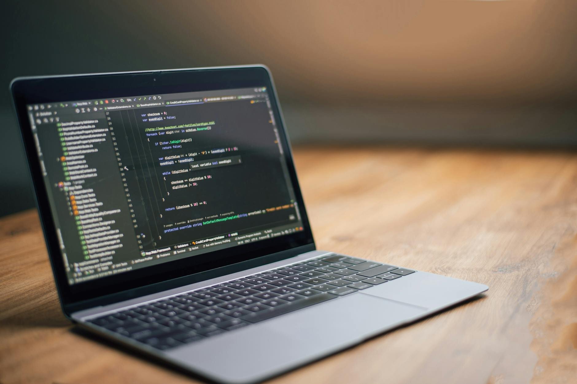a laptop with coding and html windows open