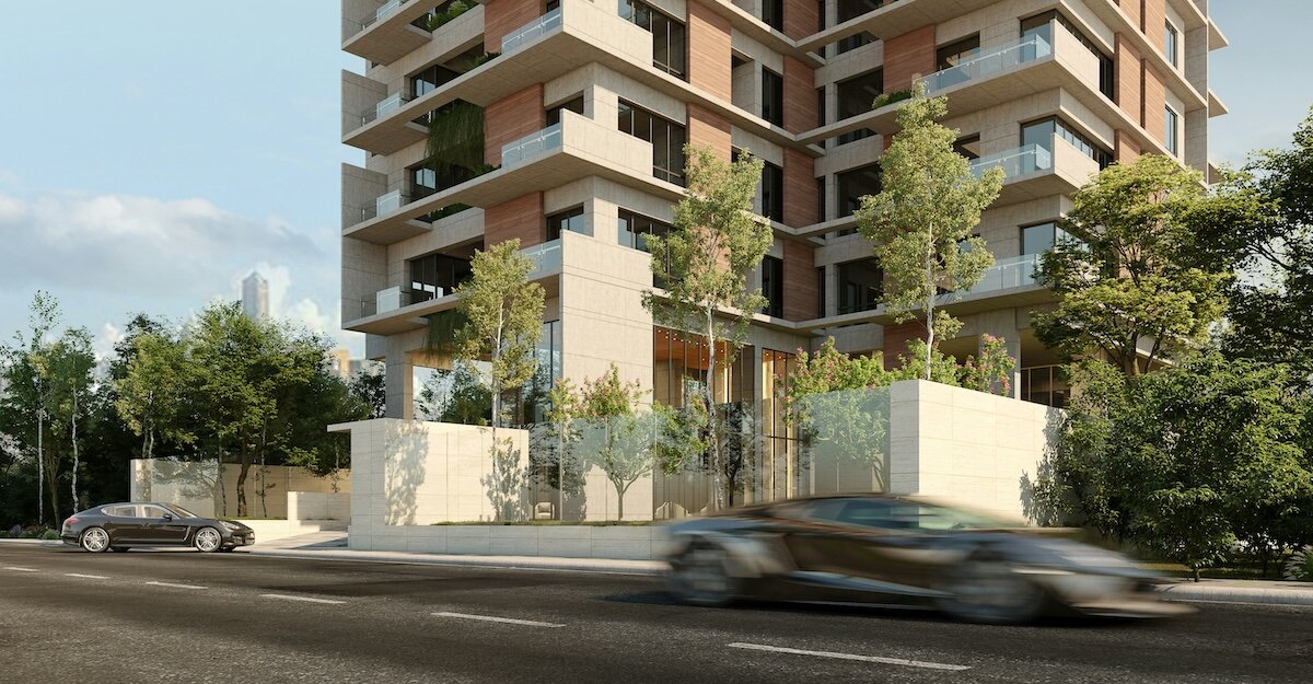 An artsy designed multifamily building with fast-moving cars in the foreground