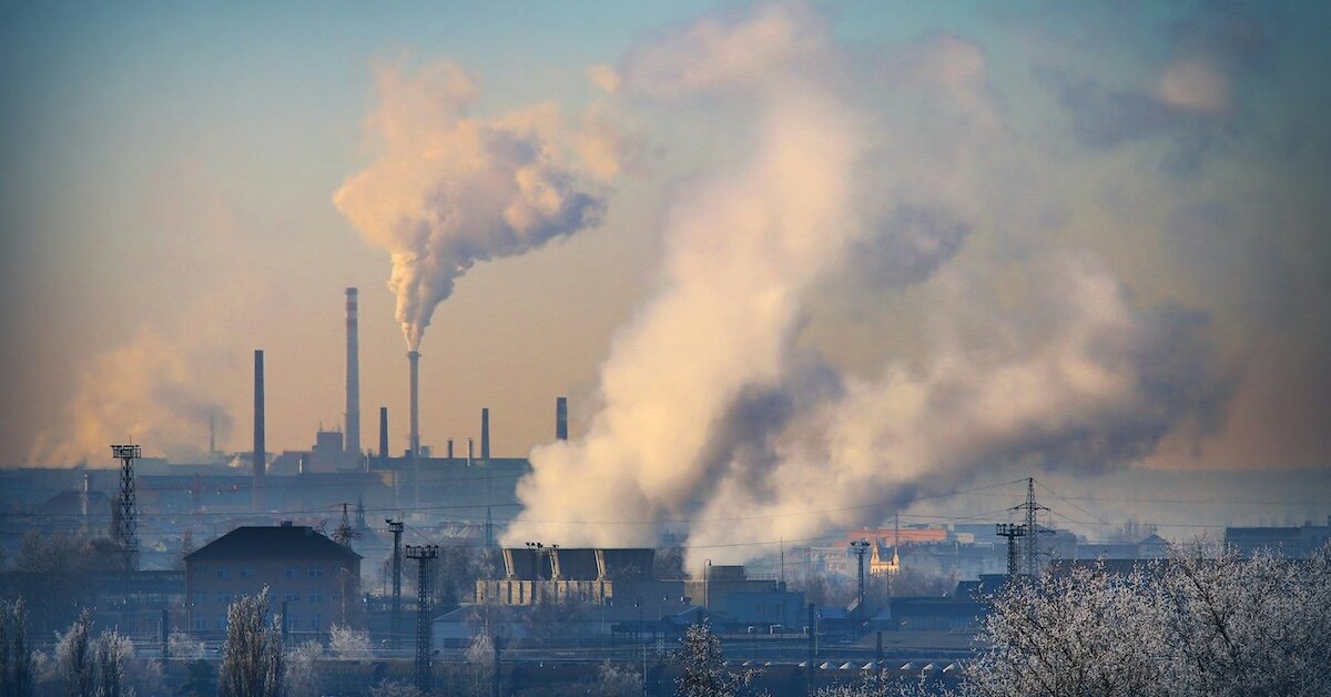 industrial buildings pushing smog into the air