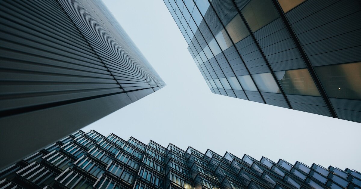 Abstract photo of commercial real estate buildings as seen from below