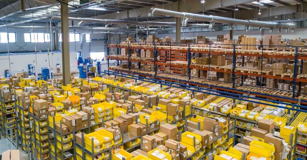 several boxes and shelves stacked inside an industrial warehouse