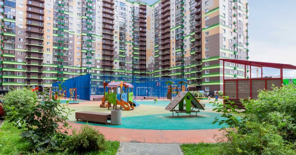 Cityscape of a residential area with modern apartment buildings, city housing developments blue sky background. Commercial real estate buildings concept.