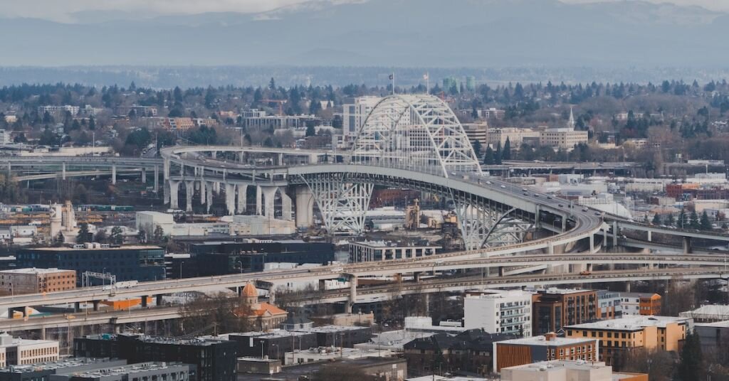 Freeways and industrial buildings surround a bridge in Portland, Oregon