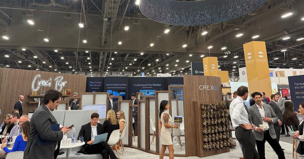 People moving around the Crexi booth at ICSC Las Vegas 2026