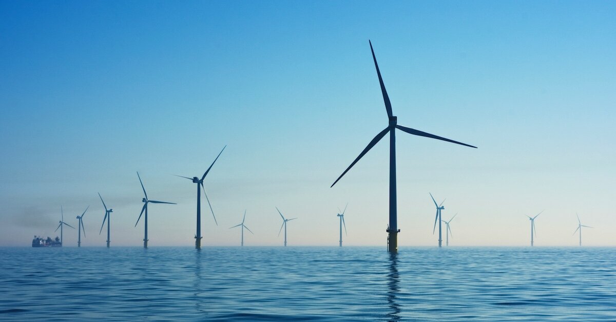 A wind farm with turbines in the ocean