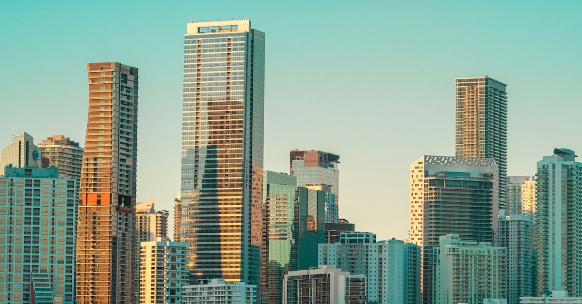 The sun reflects off of skyscrapers in a downtown city center