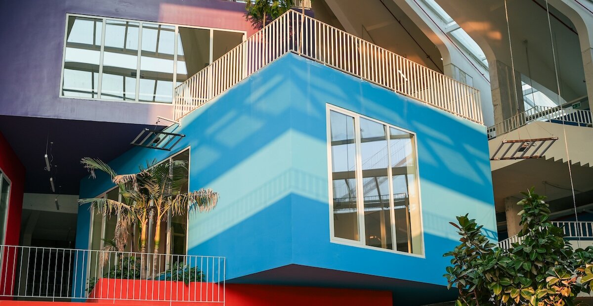 A colorful stack of multifamily apartment buildings, one of the main commercial property types