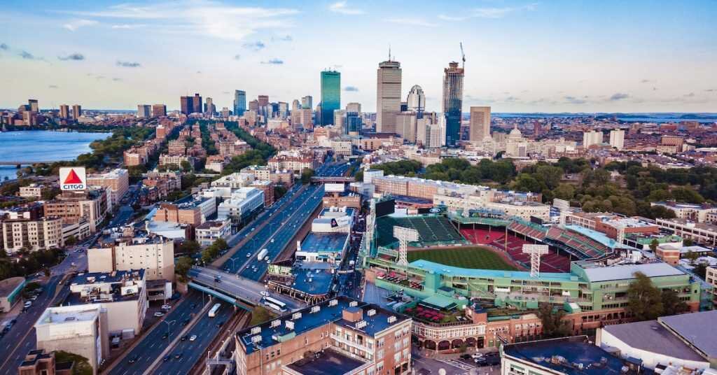 skyline view of Boston, Massachusetts with the harbor and Fenway Park visibile