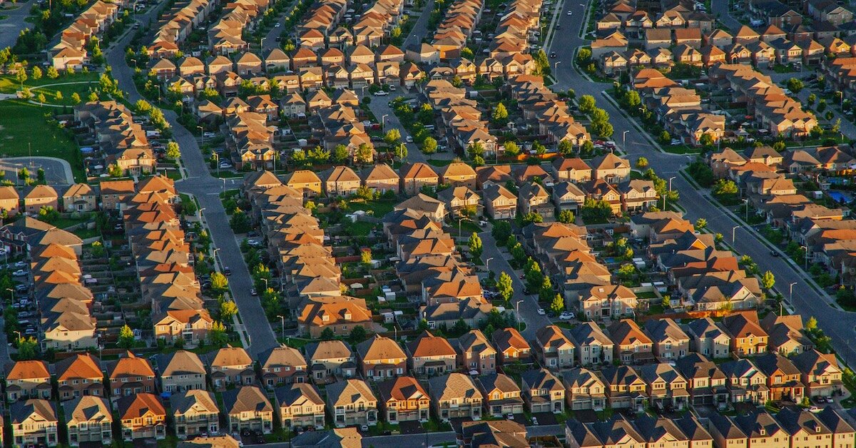 A suburban neighborhood of single family housing seen from a drone shot