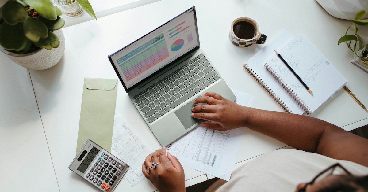 Reviewing charts and data on listings on a laptop
