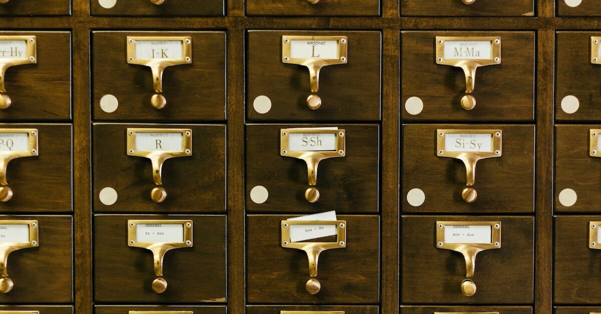 an organized filing cabinet representing the organization of brokerage data