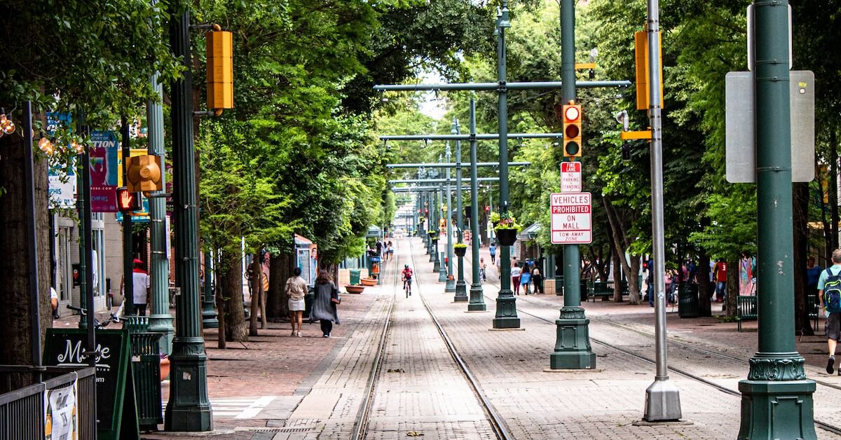 A cyclist biking down Memphis' train tracks in the downtown area