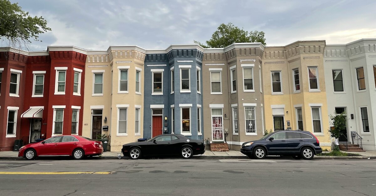 Apartment and multifamily homes in Washington DC with cars that match the buildings' colors out front