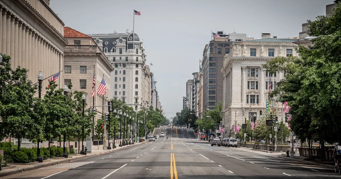 A downtown street view lined with American flags in Washington DC