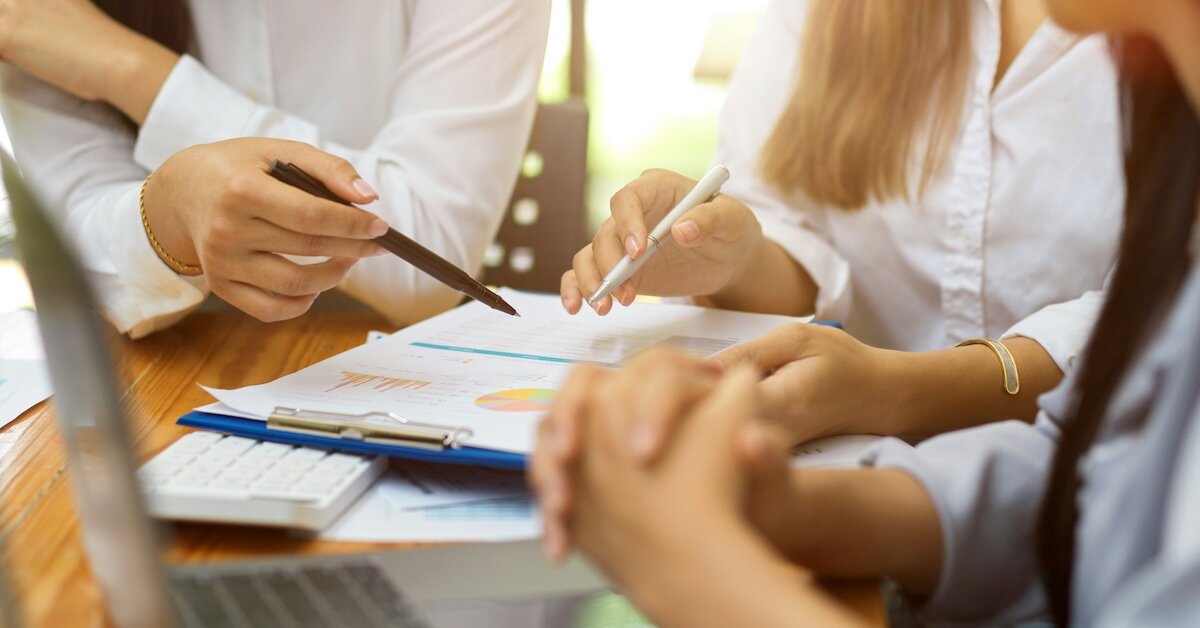 Investors reviewing a graph with property data on each parcel
