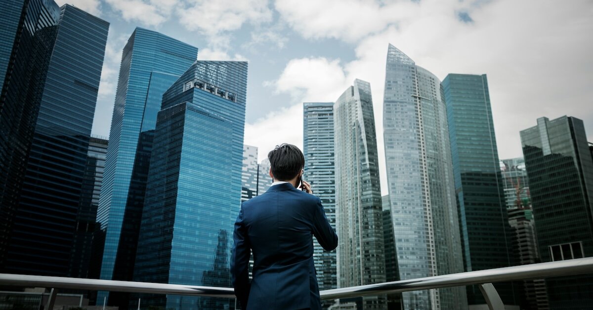 a broker on the phone looking at commercial buildings