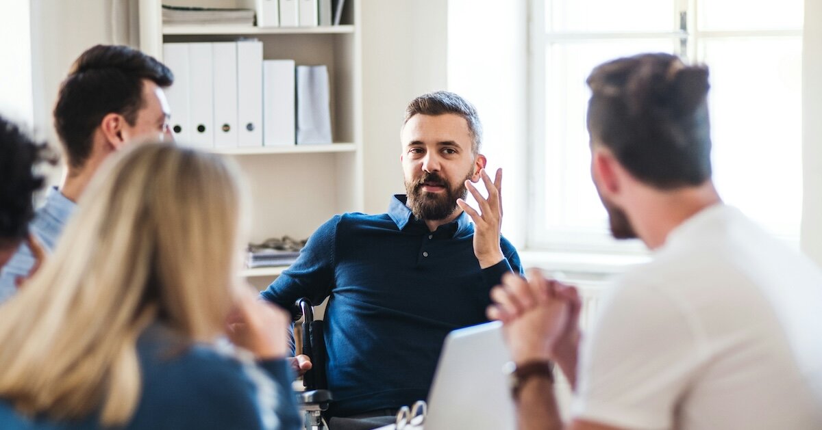a team of people talking through an offer on a deal