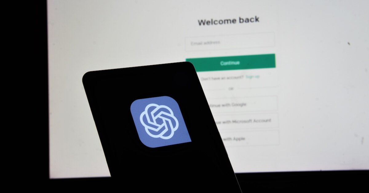 a screenshot of Open.Ai's logo in front of a login screen