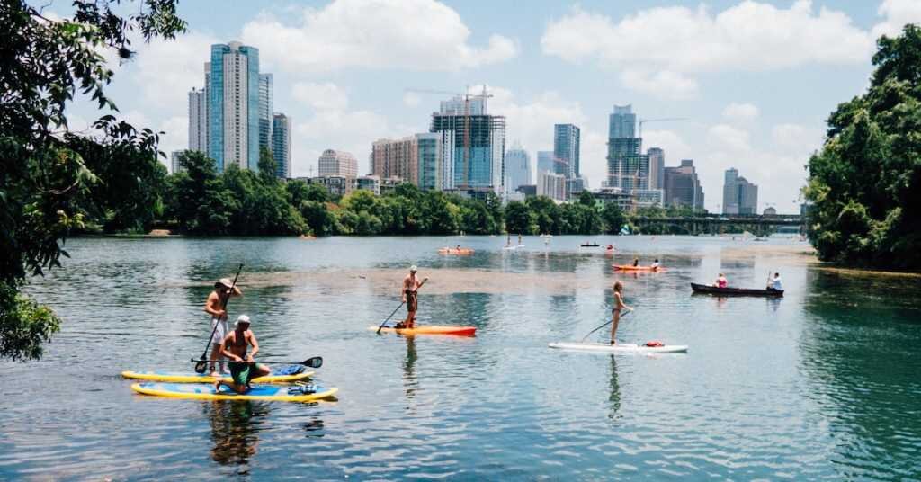 Downtown Austin Texas in the distance with paddleboarders in the foreground 