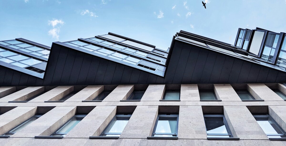 The side windows and angles of a commercial building