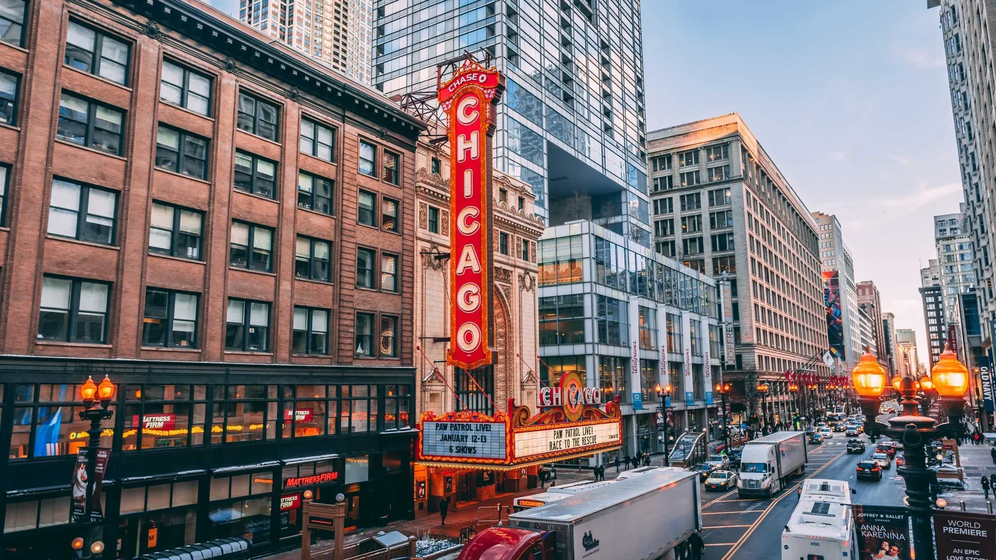 Downtown Chicago with a building featuring the city's name on a marquee
