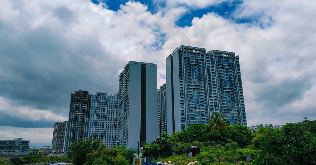 Tall buildings with greenery in the foreground