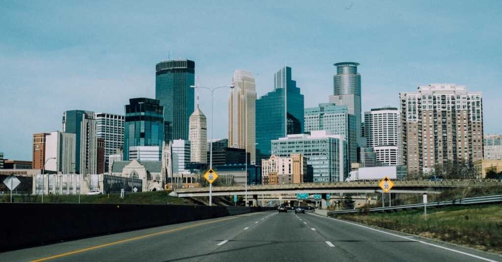 A freeway view of downtown Minneapolis with high-rise office buildings
