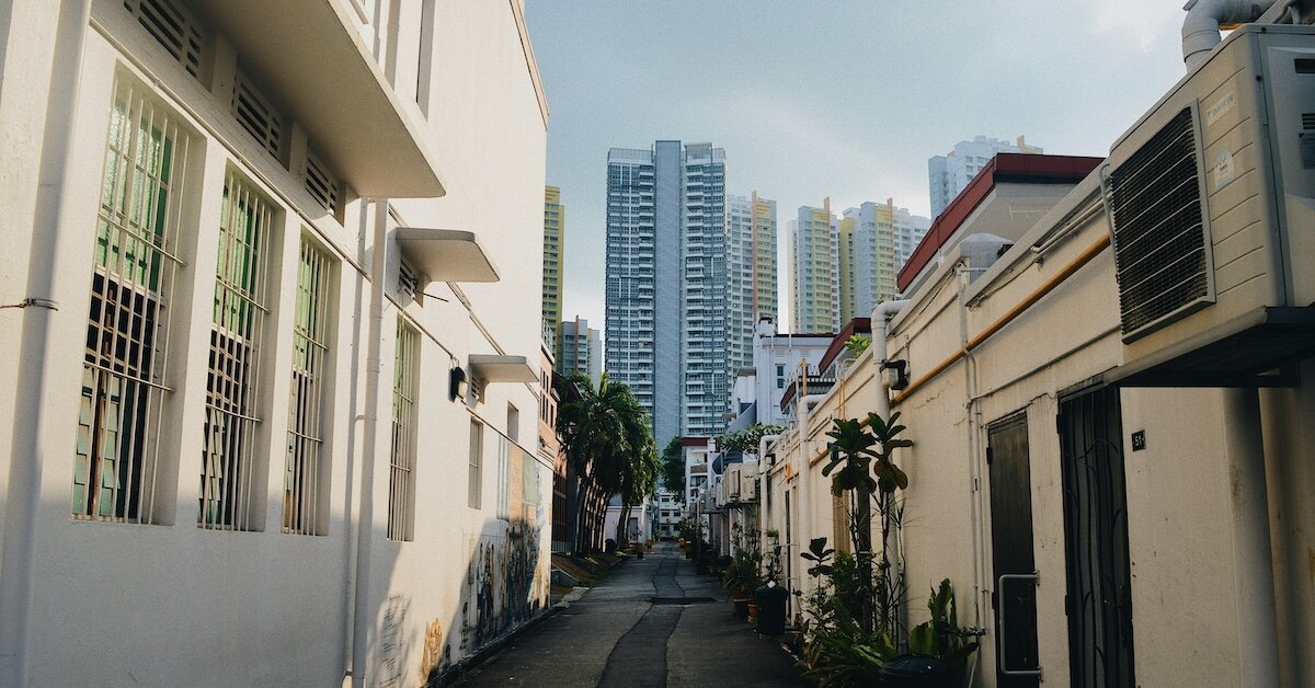 Downtown commercial real estate buildings as seen from a neighborhood alleyway in the foreground