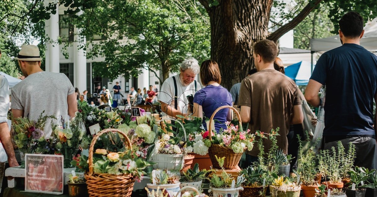 Customers at a farmers market in downtown Louisville