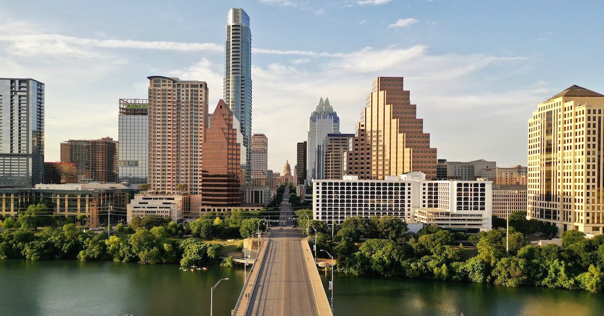 Bridge into urban skyline at golden hour.