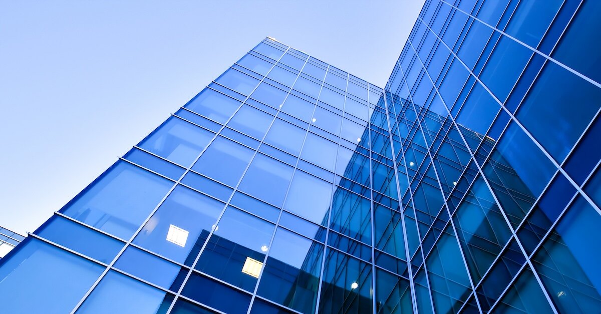 Blue windows on a stretching commercial building