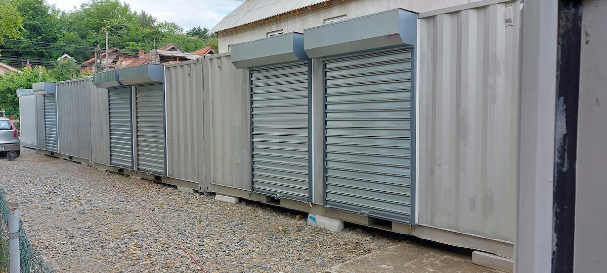 a row of shipping container self storage units