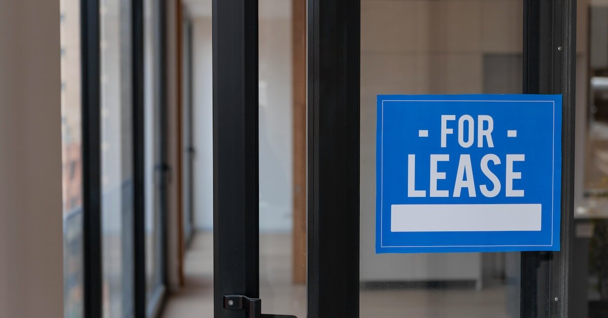 A for lease sign in an empty office building
