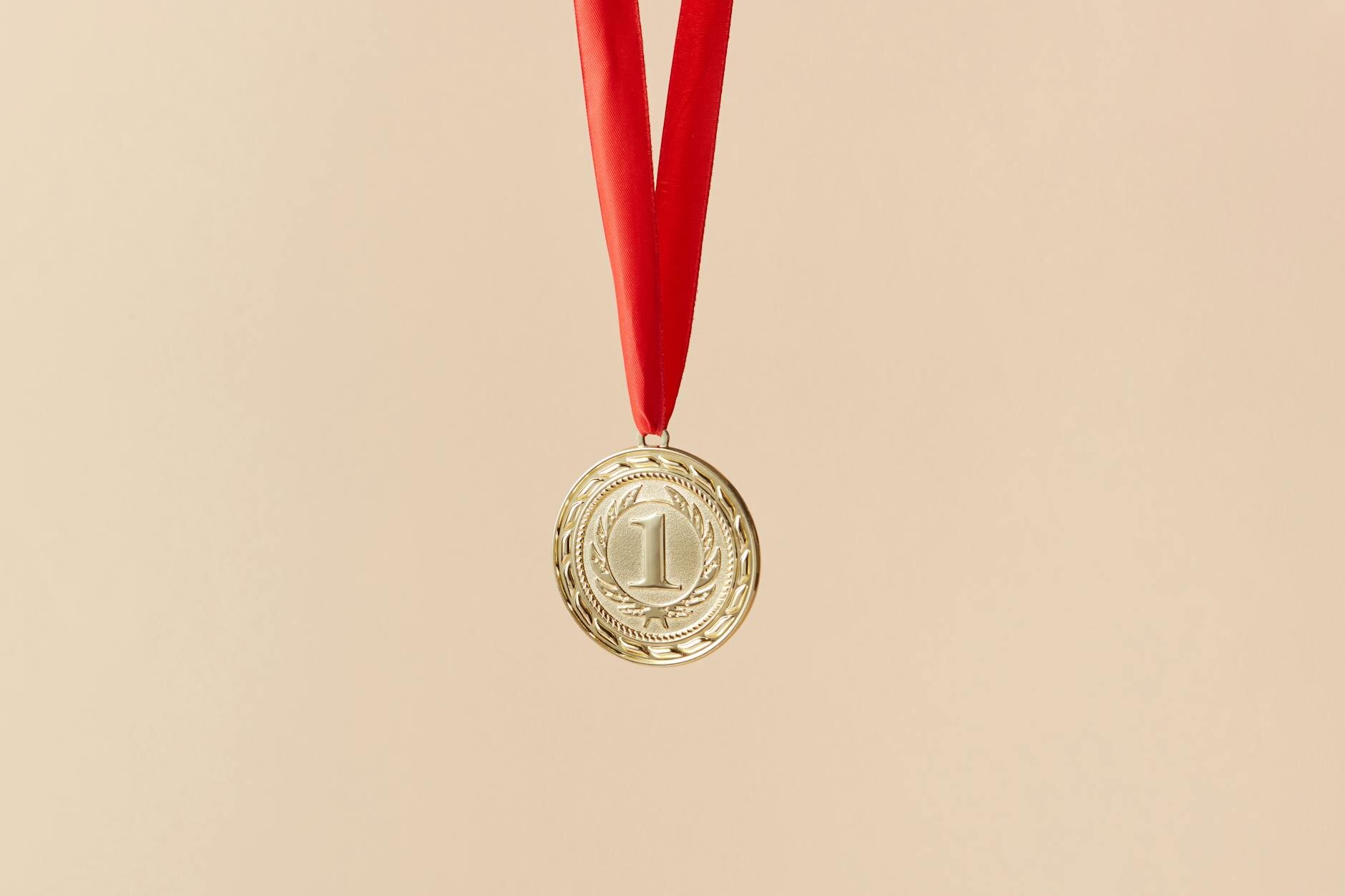 first place medal on red ribbon