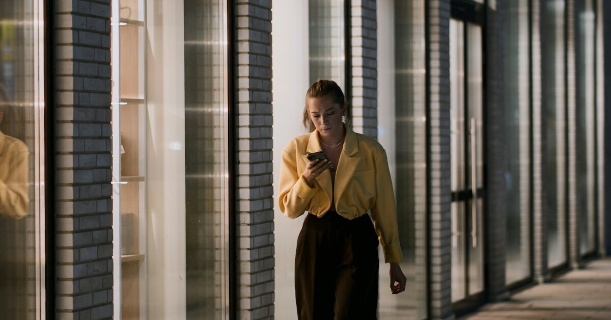 a woman talking to an AI on her phone