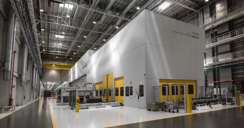 the inside of a warehouse and audi factory